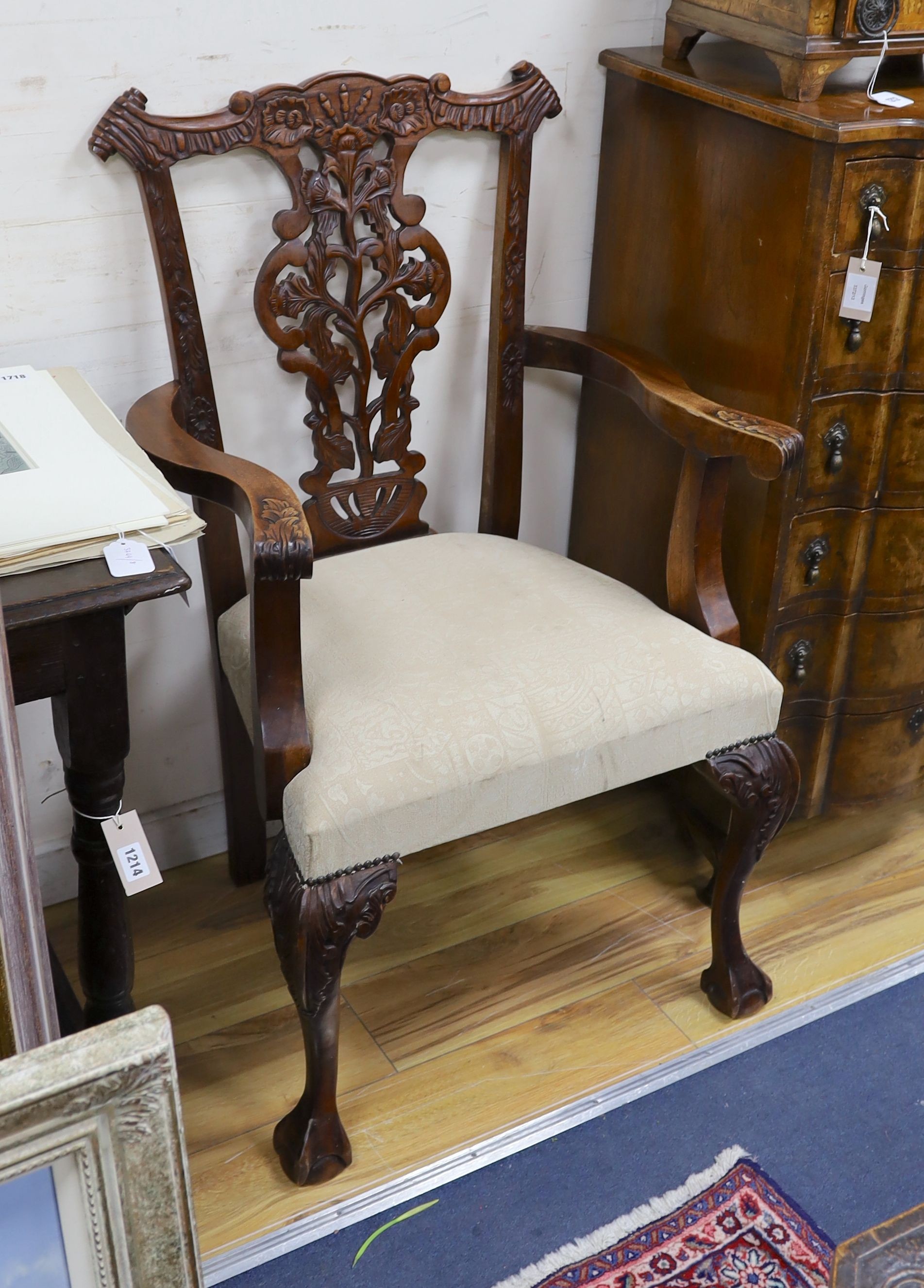 A pair of Chippendale style mahogany elbow chairs, width 67cm, depth 57cm, height 106cm